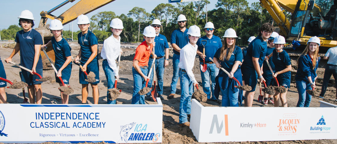 Groundbreaking ceremony at Independence Classical Academy with students, faculty, and community members turning the dirt for the new upper campus expansion.