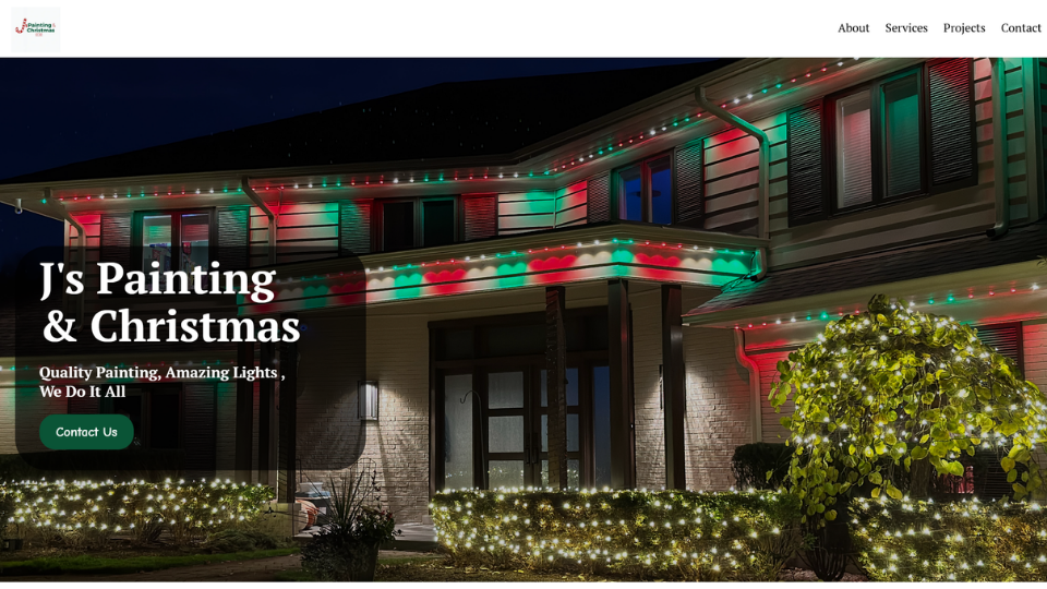 Large two-story house decorated with red, green, and white Christmas lights on the roofline, porch, bushes, and tree at night.
