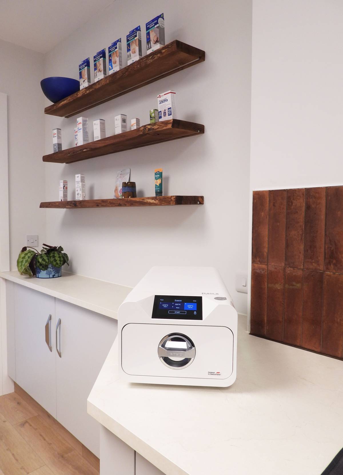 The sterilisation unit at Kenmare Foot Clinic, beside shelves of foot care products.