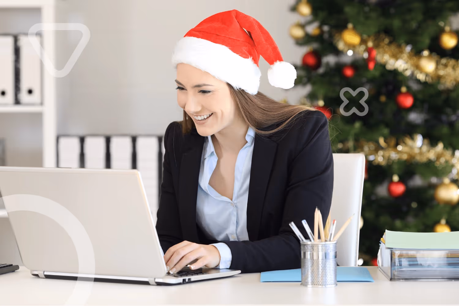 smiling businesswoman on laptop planning virtual holiday employee event