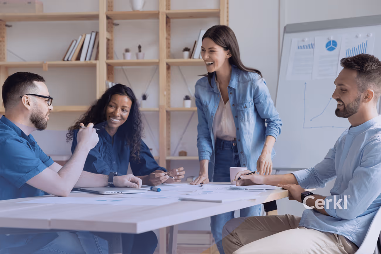 Internal communications leader reviewing measuring employee experience framework and strategy notes in a team meeting