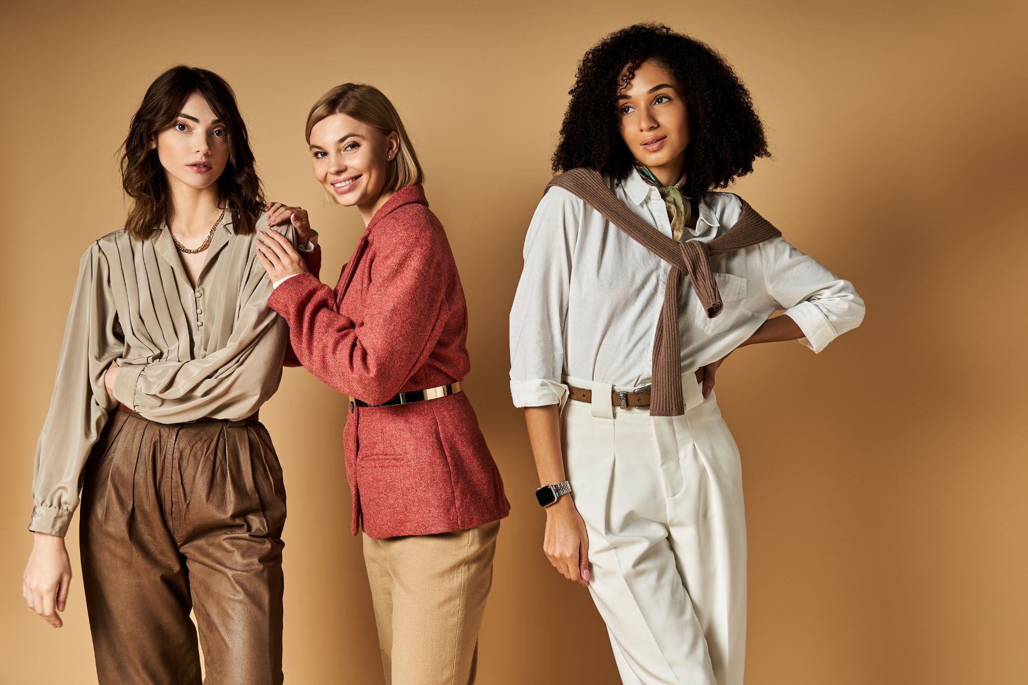 Three women styled in coordinated tailoring, demonstrating balanced outfit combinations for the 7-point rule 