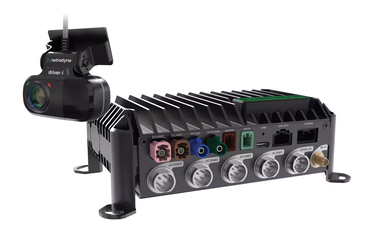 Netradyne Driveri D-810 device with multiple color-coded camera and connectivity ports alongside a black camera unit.