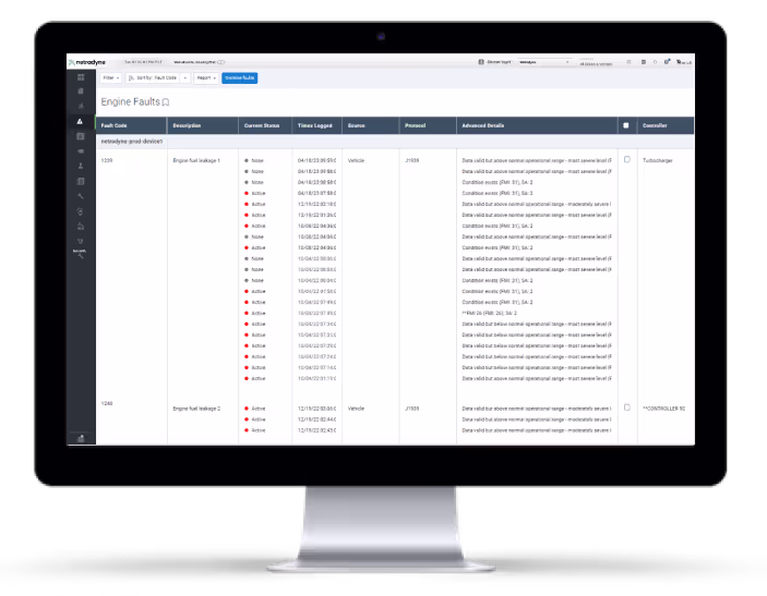 Computer monitor displaying a Netradyne dashboard showing engine fault codes, descriptions, current status, timestamps, sources, protocols, and advanced details for vehicle diagnostics.