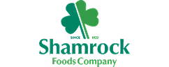 Green shamrock icon above the text 'Shamrock Foods Company' in green font.
