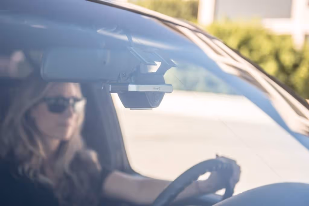Focused driver, driving a car with fleet safety technology.