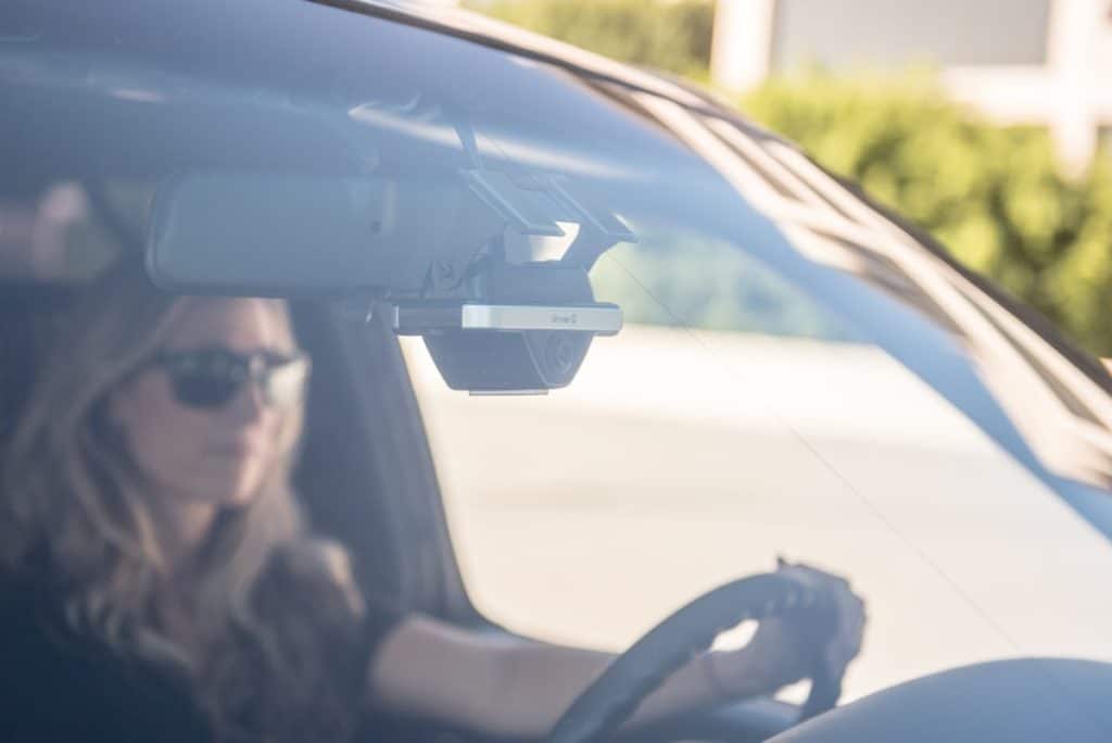Focused driver, driving a car with fleet safety technology.