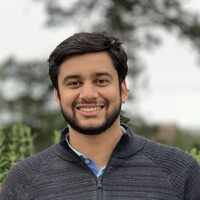 Portrait headshot of Poojit Sharma.