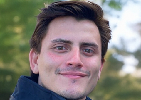 Portrait headshot of Milo Flores.