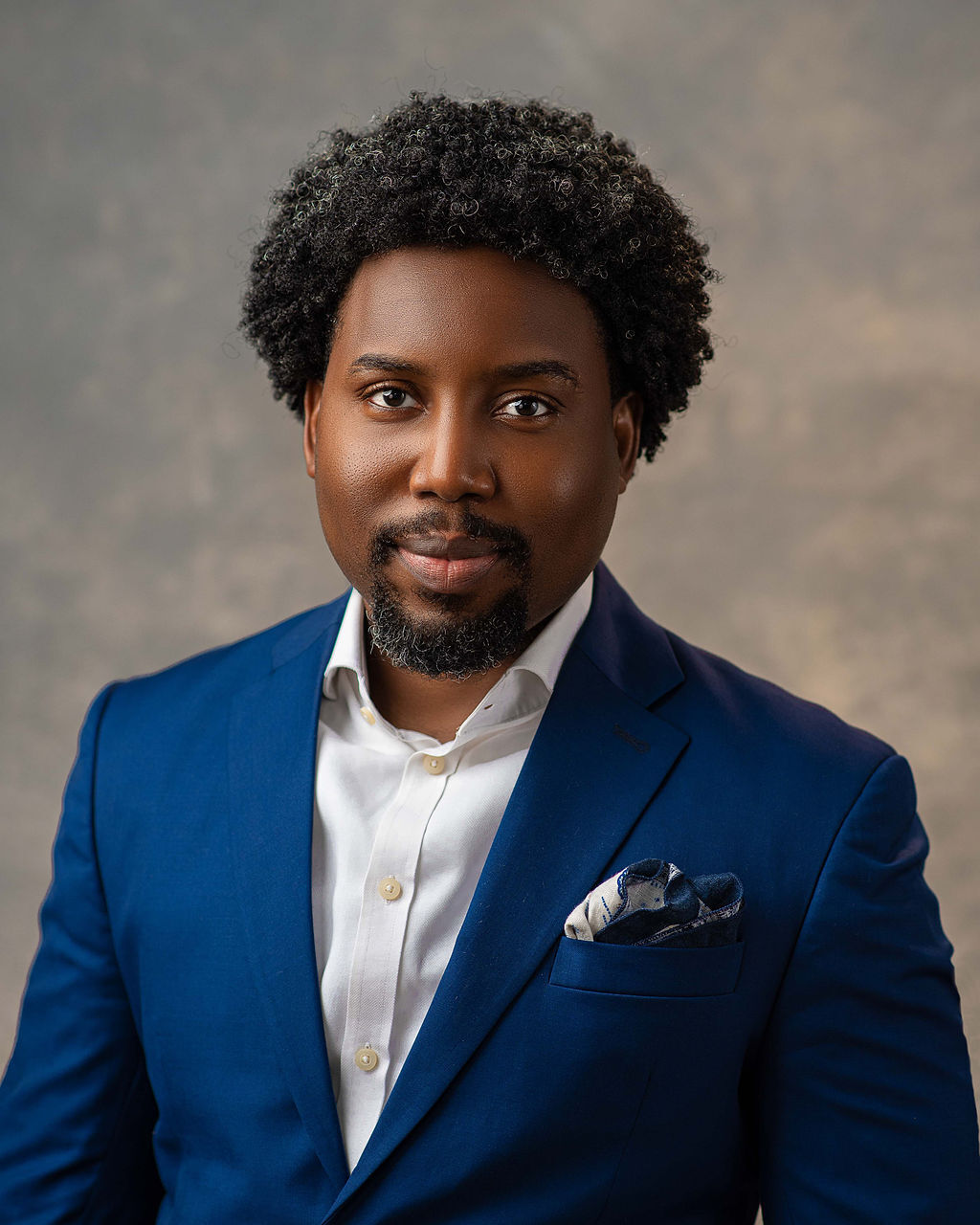 A headshot photo of Deji Amund