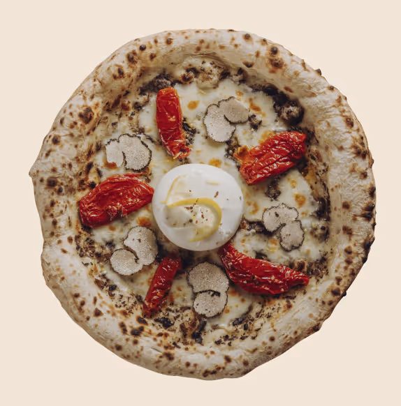 Gourmet pizza topped with white truffle slices, roasted red peppers, and a dollop of creamy cheese in the center.