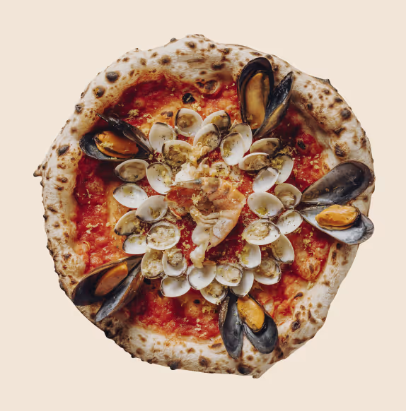 Seafood pizza topped with mussels, clams, and shrimp on a crispy crust with tomato sauce.