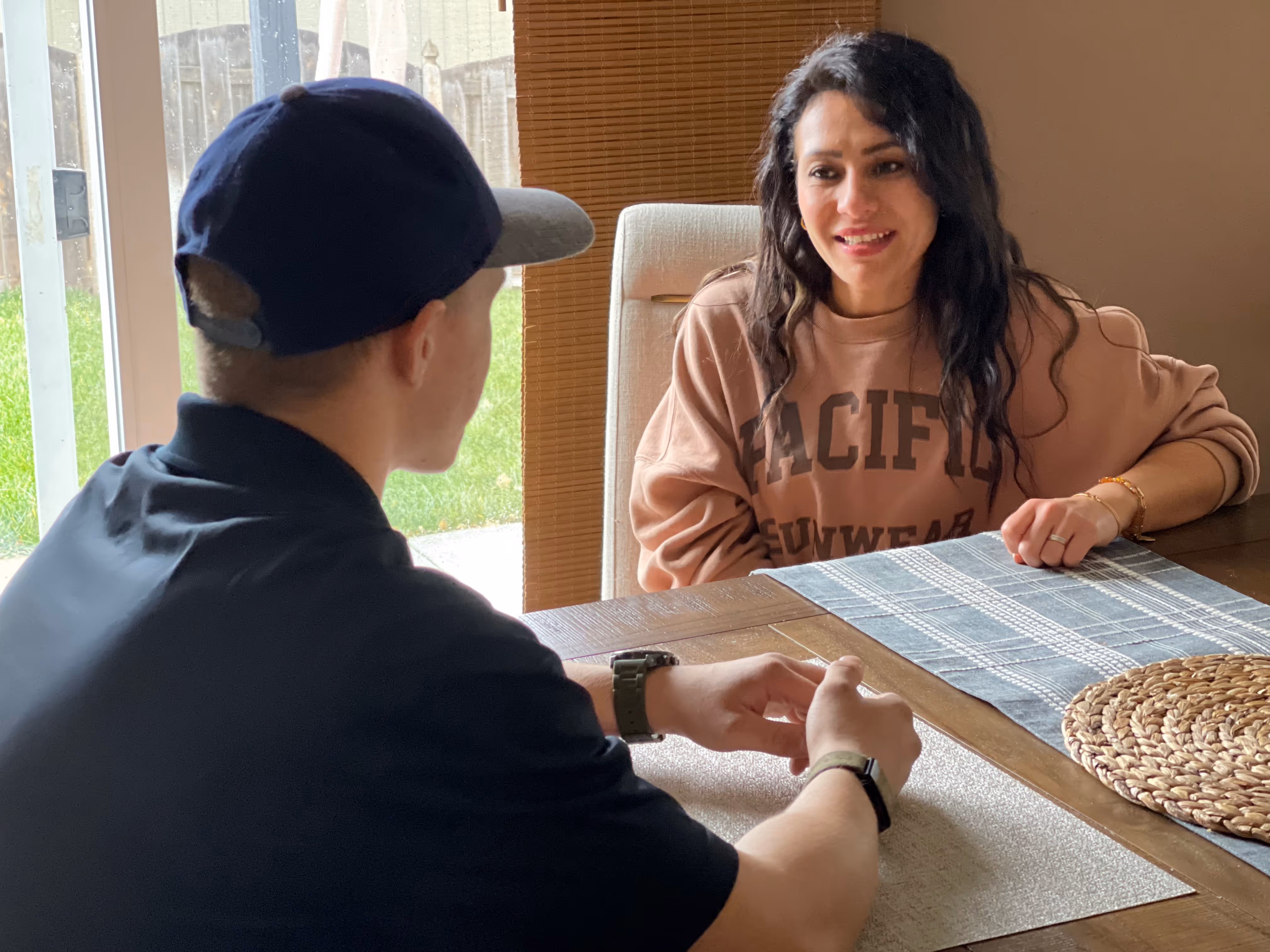 Brightly technician greeting a homeowner at the door