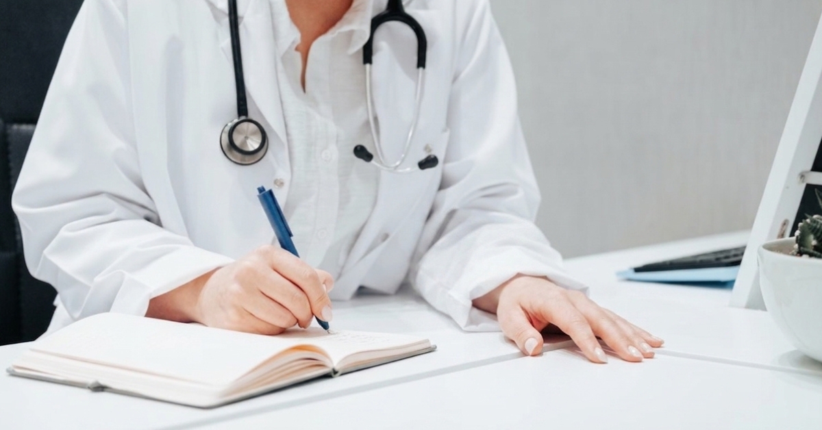 Doctor discussing overall health factors relevant to fertility evaluation