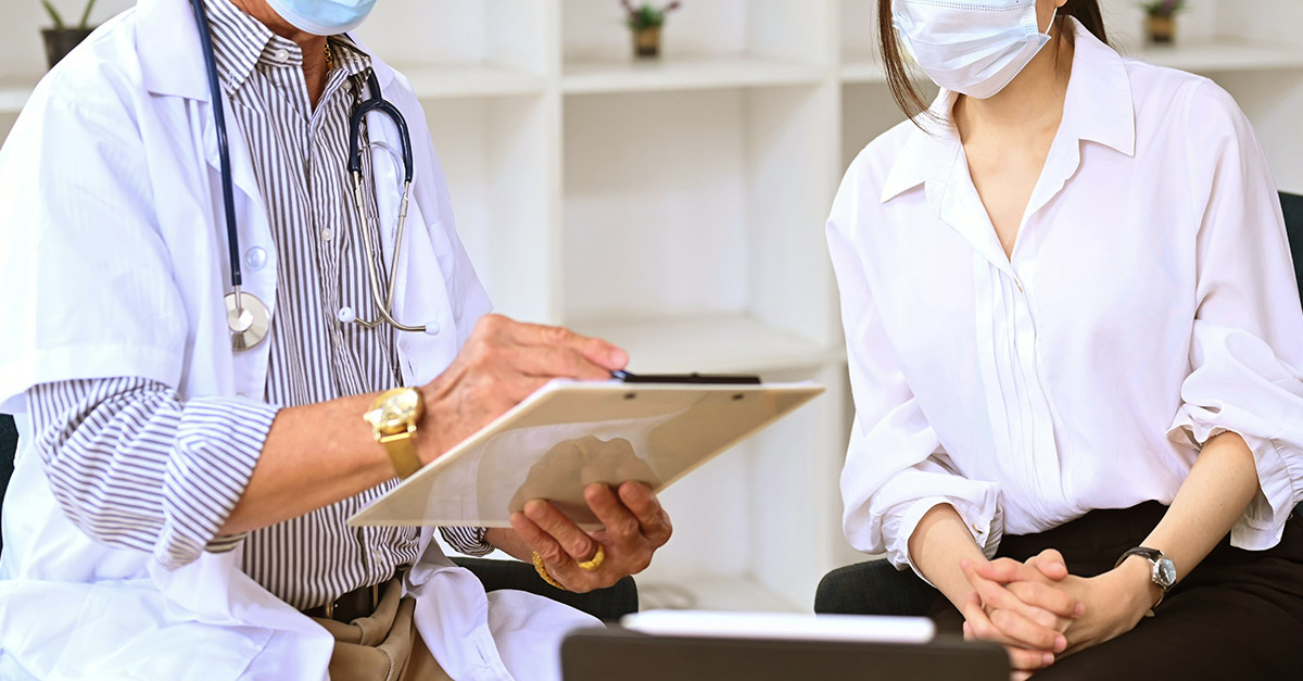 Fertility specialist discussing IVF timing for PCOS patient