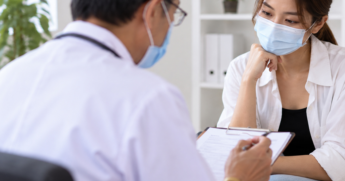 Doctor and patient during a first fertility consultation discussion