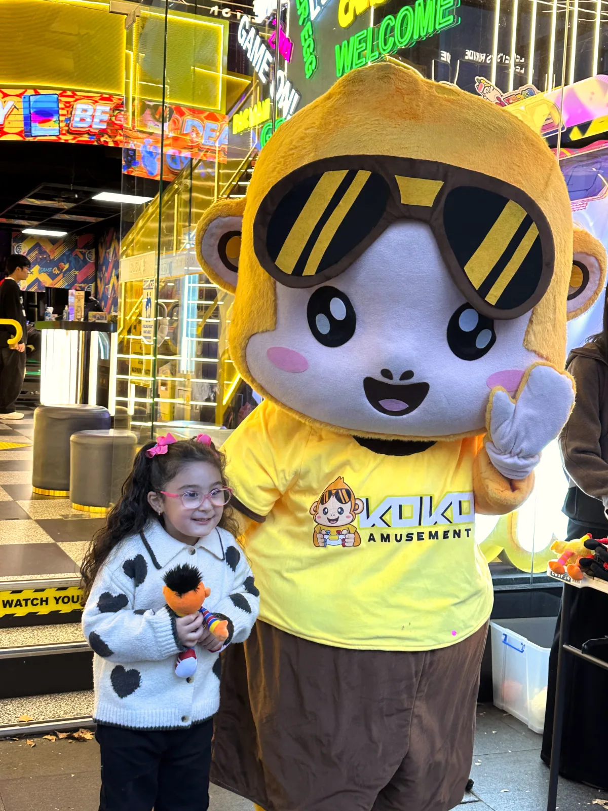 George the KOKO Amusement mascot greeting families at the arcade