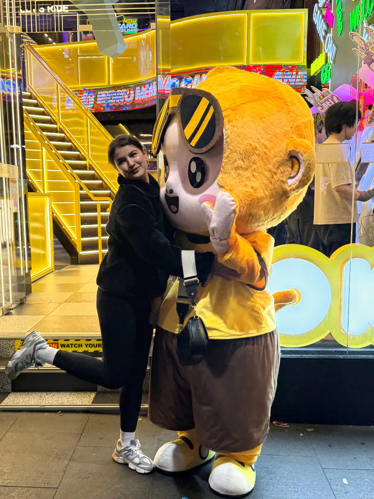 George the KOKO Amusement mascot with a visitor at the arcade