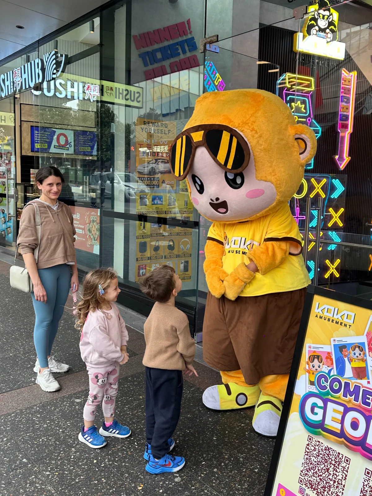 George the KOKO Amusement mascot meeting kids at an event