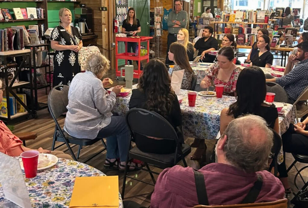 Mind Above Matter's Tracie Owen highlights key services and programs during the Denton Neighbors Network event.