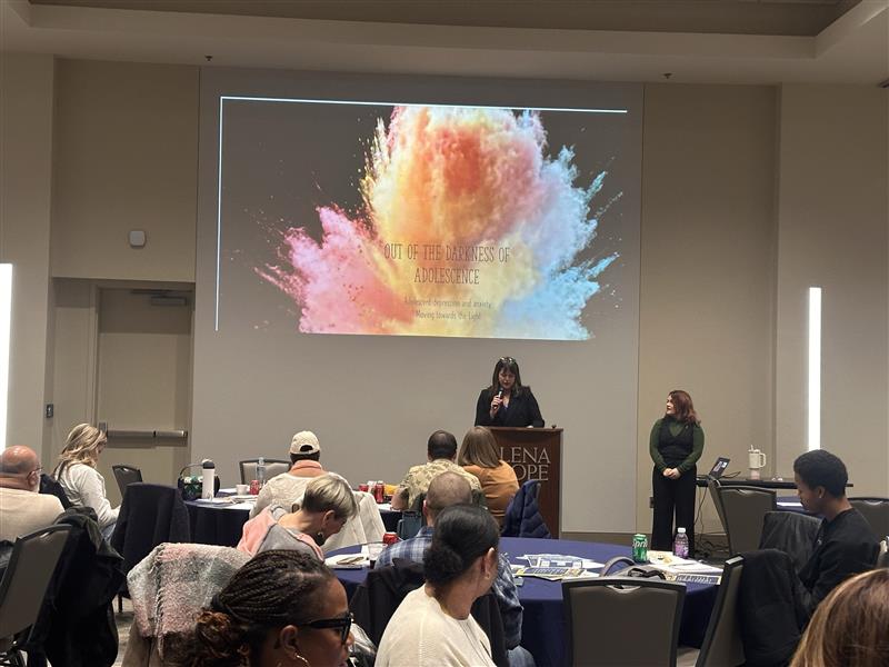 A presentation slide with the title: 'Out of the Darkness of Adolescence: Dealing with Depression & Anxiety and Moving Towards To Light.' Presented by Courtney Wilson, LPC of Mind Above Matter. This slide was featured at the 3rd Annual Resiliency & Recovery Mental Health Conference of Fort Worth on February 21st, 2025.