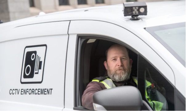Aberdeen City Council warden beside a TES GEN6 ANPR enforcement vehicle