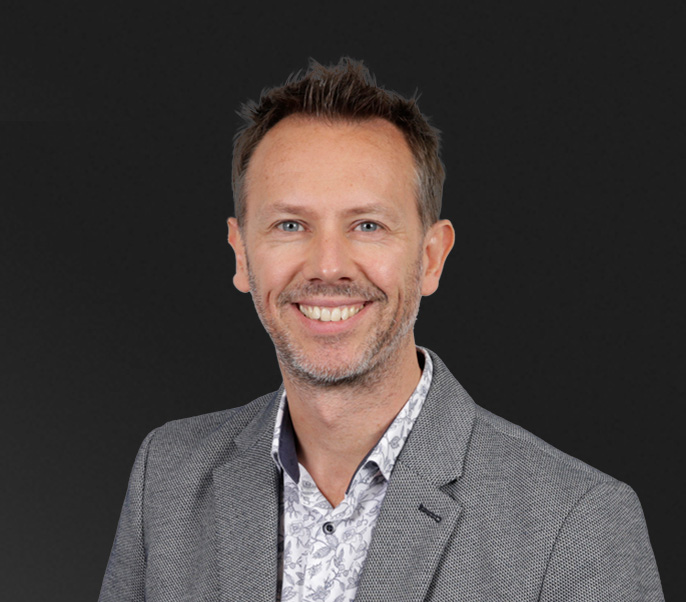 corporate headshot of Paul Mills, Chartered Fractional CMO & Founder, VCMO