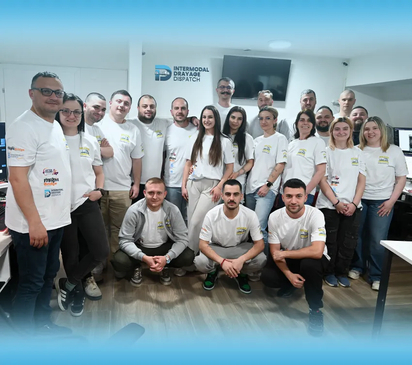 Intermodal logistics team managing container operations and drayage workflows in a professional office environment