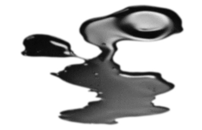 Abstract black and gray fluid shape with smooth, reflective surface on a transparent background.
