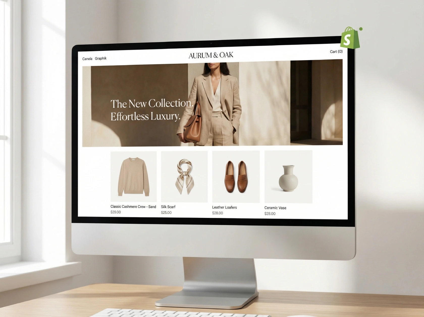 Desktop computer monitor displaying an online store homepage with a woman in beige clothing and accessories including sweater, scarf, leather loafers, and ceramic vase.