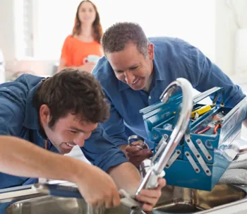 Plumber fixing a pipe