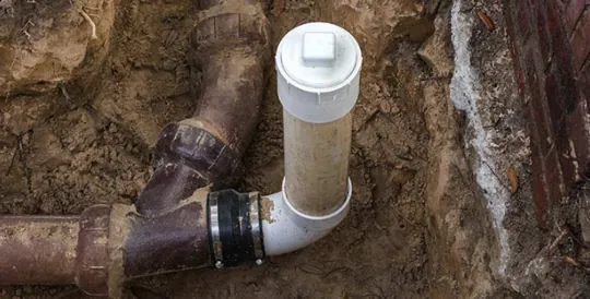 Plumber performing sewer line repair in Huntington Beach, using video inspection technology