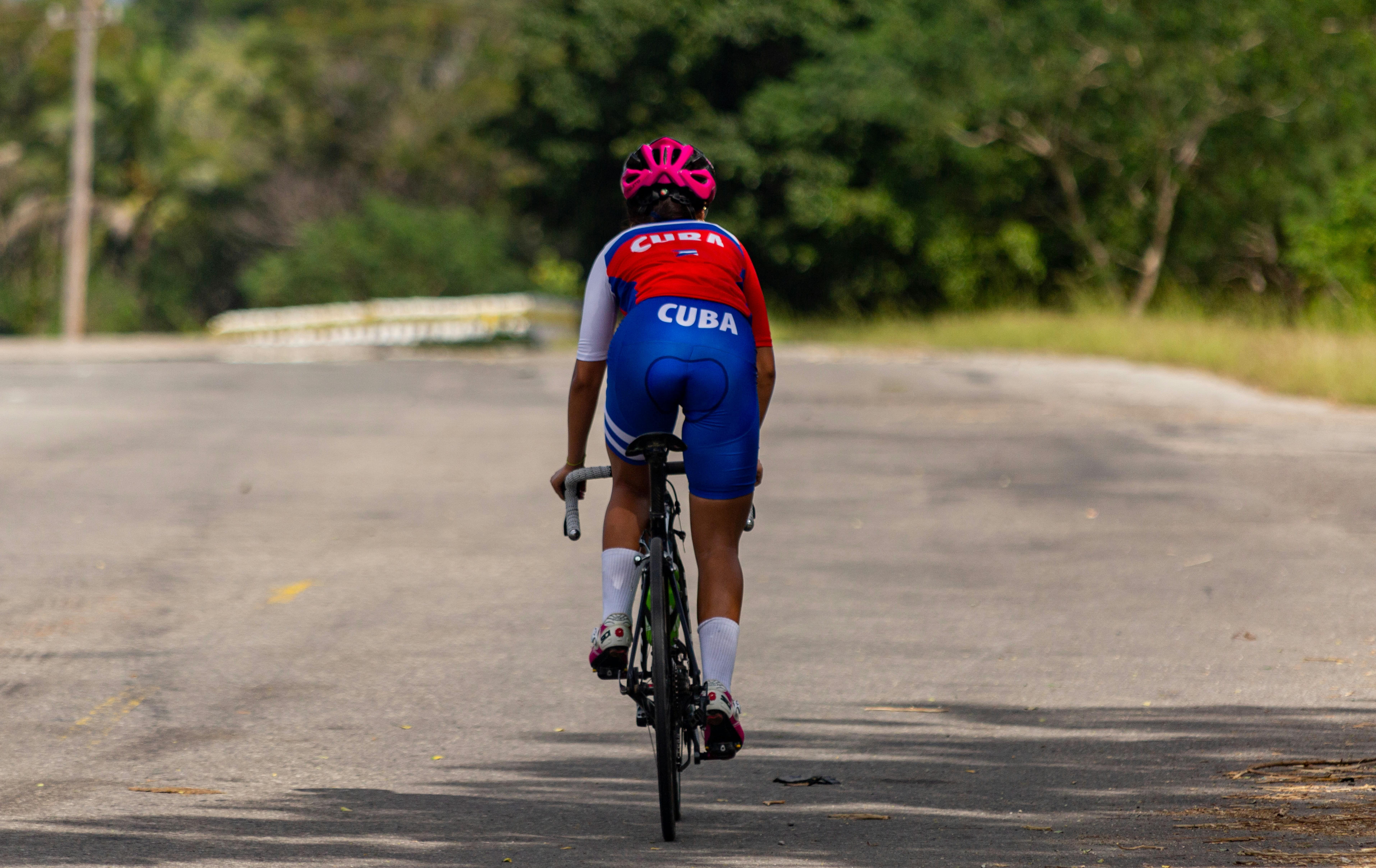 A group of Cuban women athletes celebrating together in uniform