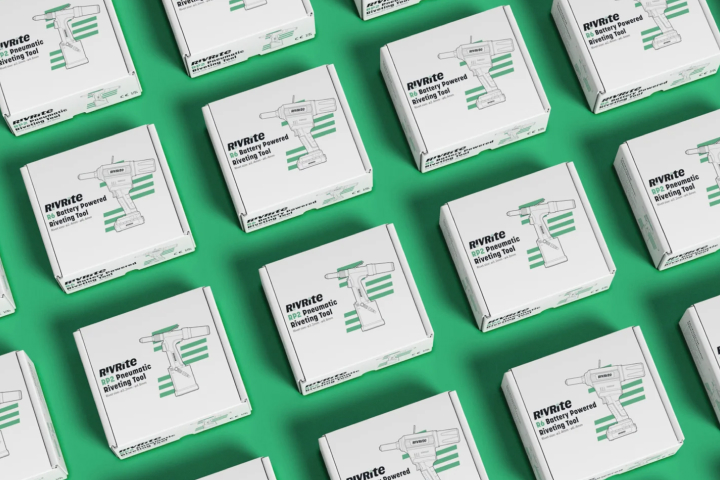 Person working on two computer screens.