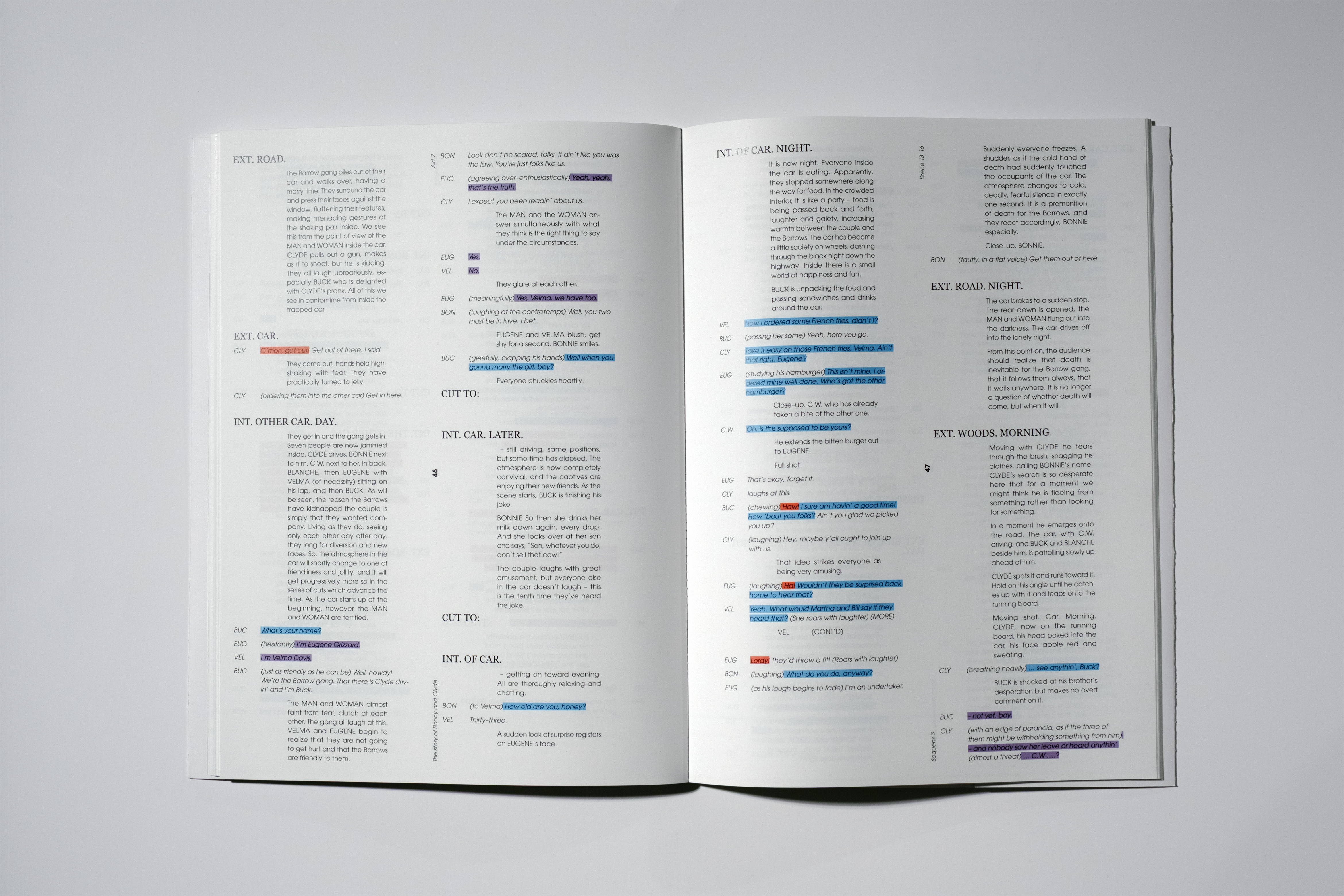 Open script pages with dialogue and stage directions, some text highlighted in blue and purple.