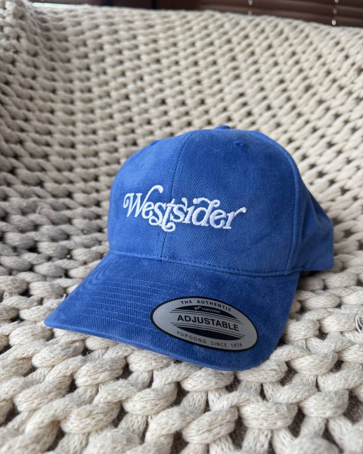 Royal blue structured cap with Westsider script embroidered in white