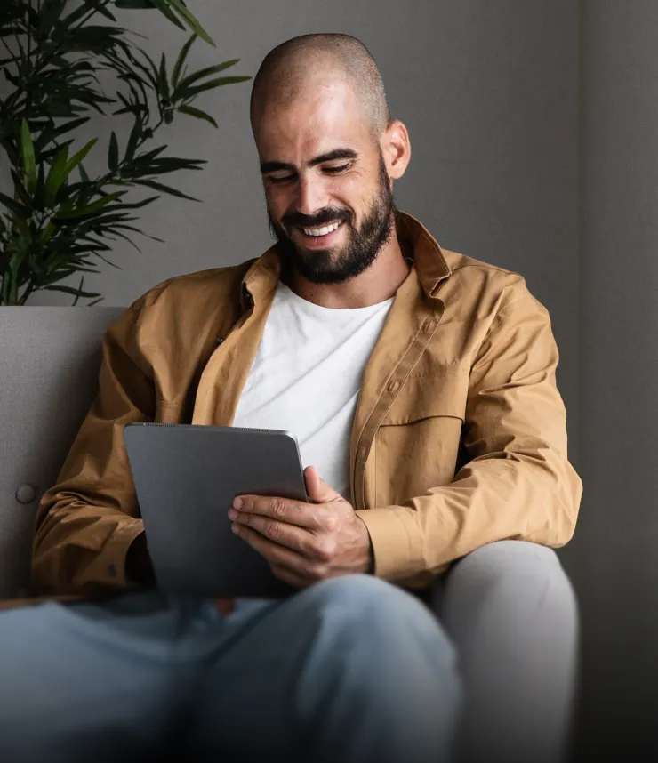 Landlord smiling at a tablet
