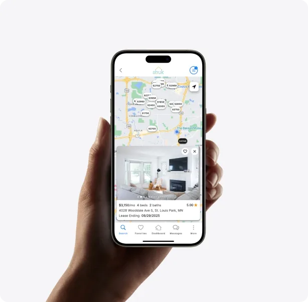 A phone showing Shuk rental listings on a map