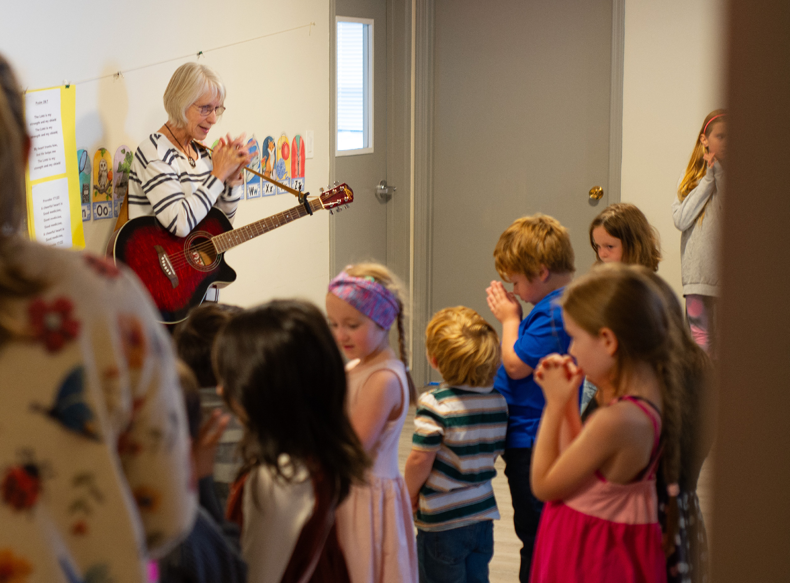 Children pray at Hammond Bay Church 