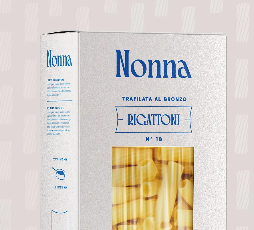 Boîte de pâtes Rigatoni Nonna, packaging blanc avec fenêtre montrant les pâtes.