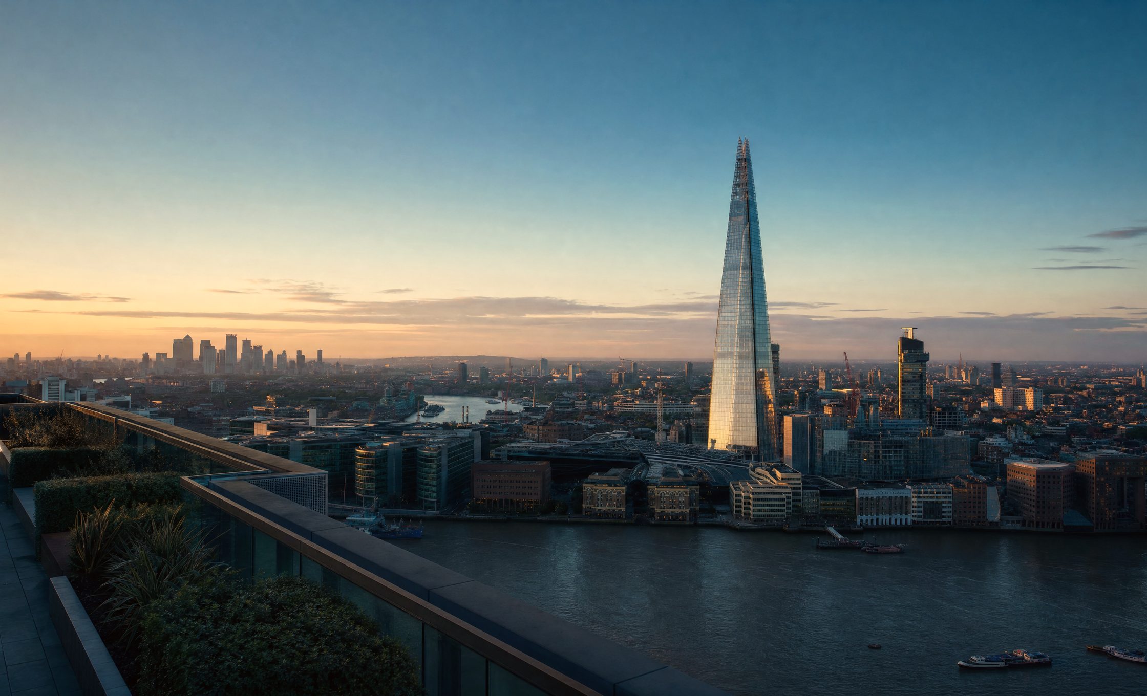 Rooftop terrace above the River Thames at dusk, The Shard and the City of London beyond