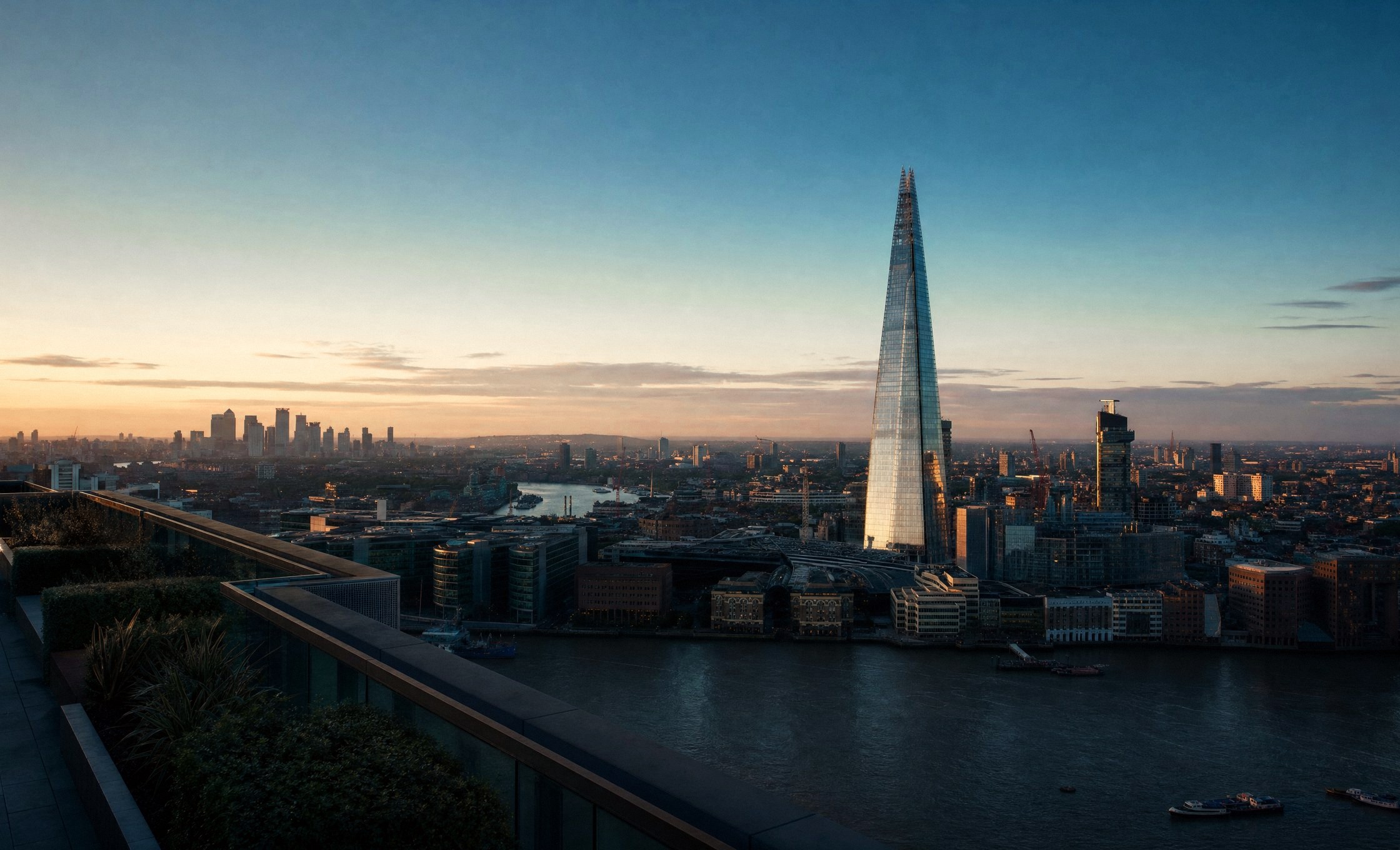 Rooftop terrace above the River Thames at dusk, The Shard and the City of London beyond