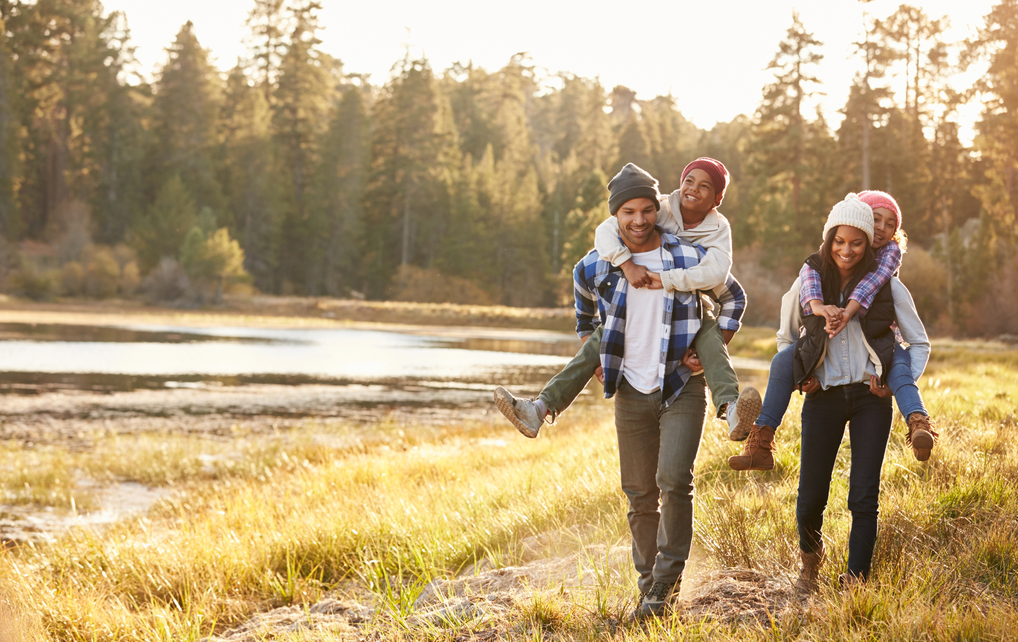 A family enjoying time together outdoors by a lake