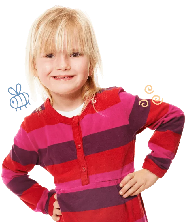 Smiling blonde girl with bangs wearing a red and purple striped long-sleeve shirt with hands on hips, with small doodles of a bee and swirls nearby.