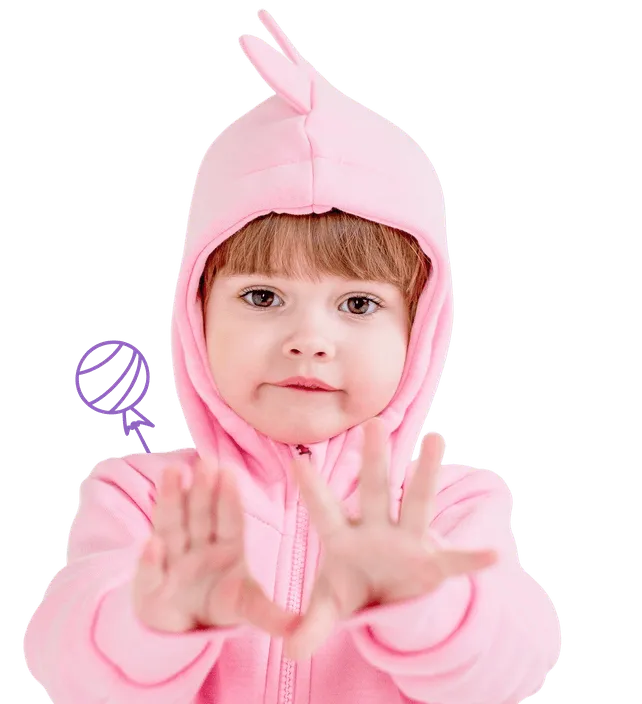 Toddler wearing a pink hoodie with a small tuft on the hood, holding hands forward towards the camera.