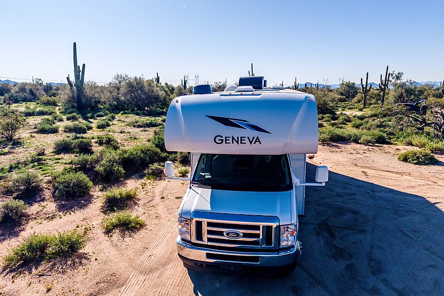 Class C motorhome at a Phoenix-area RV park with desert rock formations