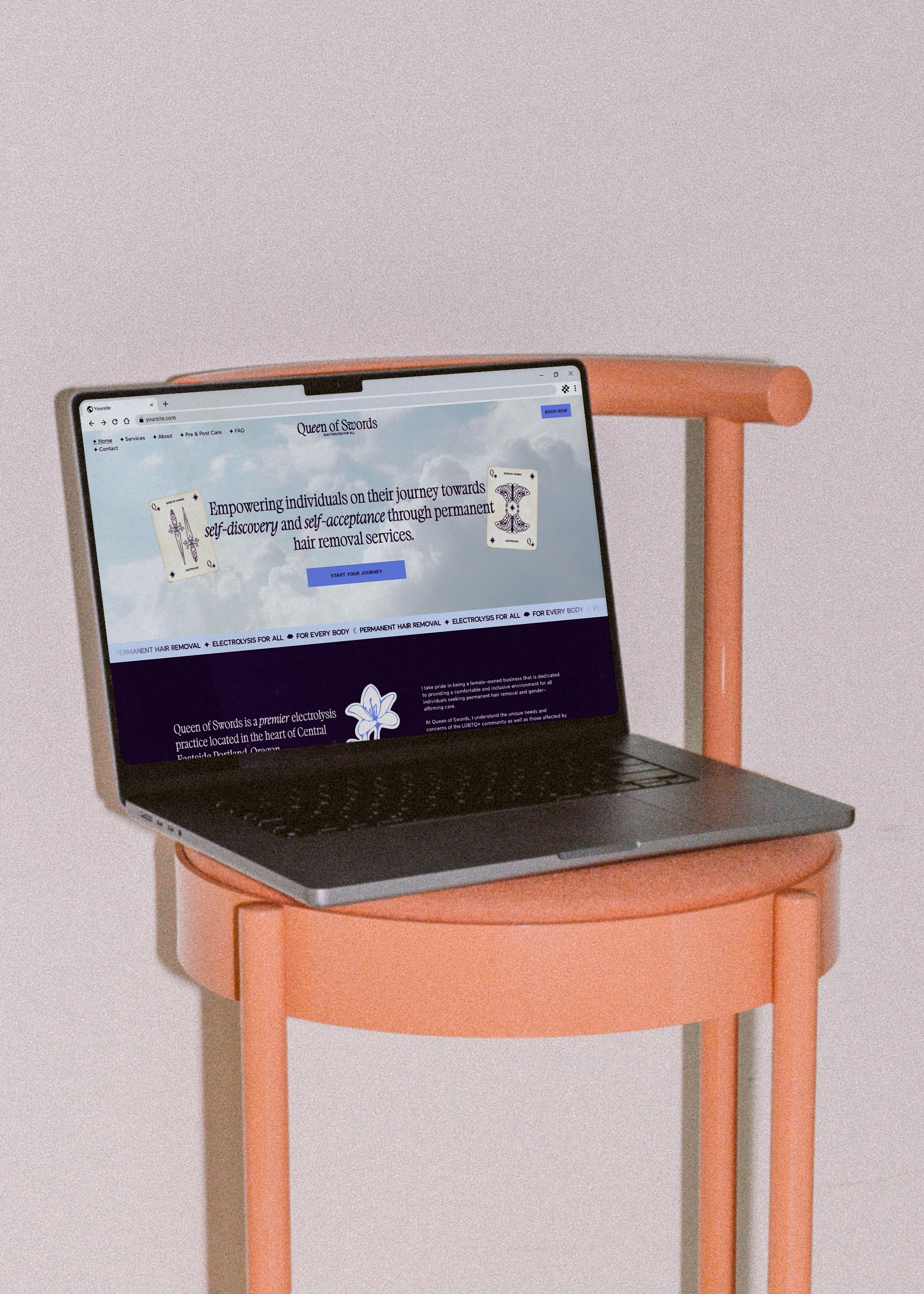 Open laptop displaying Queen of Swords website on orange wooden chair against a light wall.