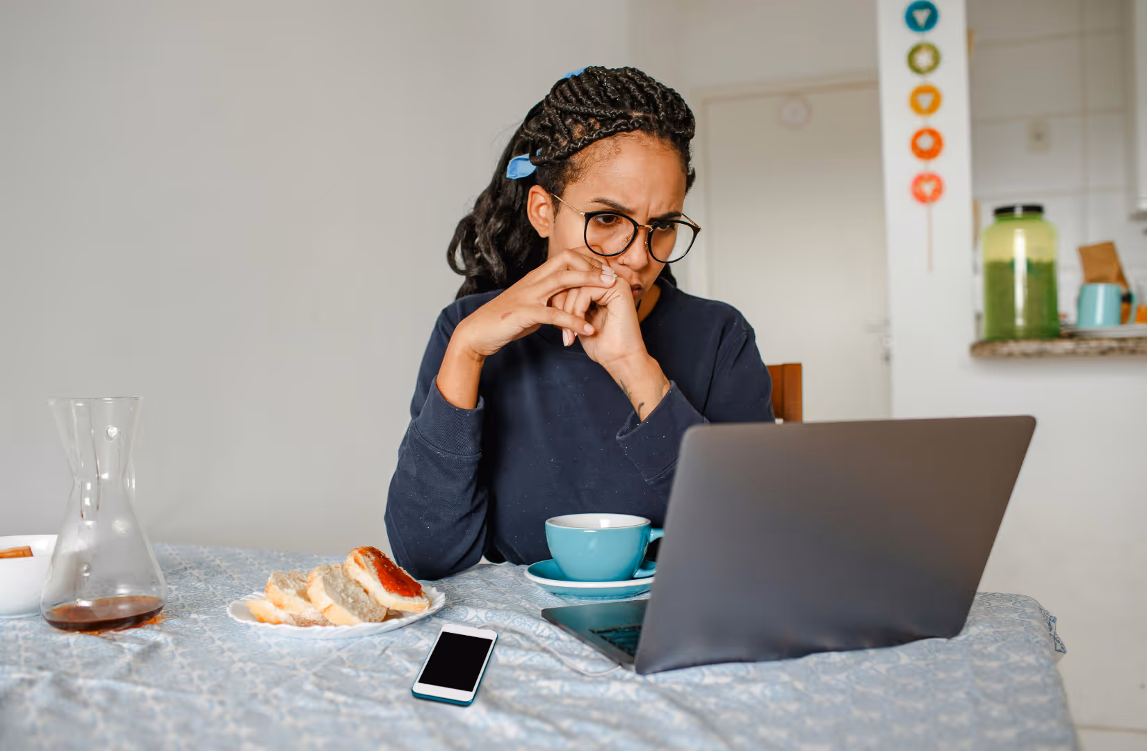 woman at computer using text messages as legal evidence of abuse coercion control