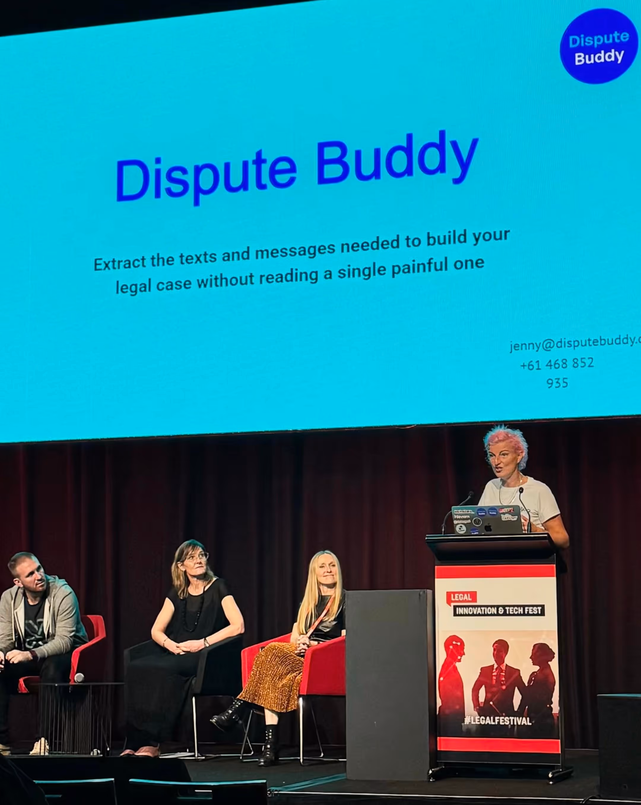 Dispute Buddy founder, Jenny Rudd, speaks on the podium while on stage with Courtney Blackman (pictured next to Jenny) at Lander & Rogers' "AI For Good" session at the Legal Innovation & Tech Fest conference in April 2025. 