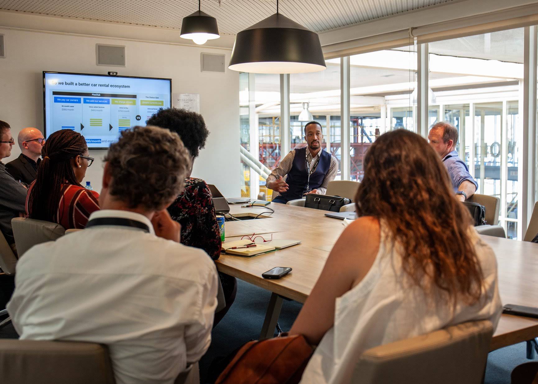 image of a team brainstorming in an office (for a web development agency)